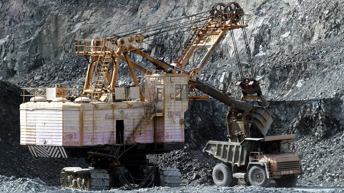 Mining excavator and dump truck