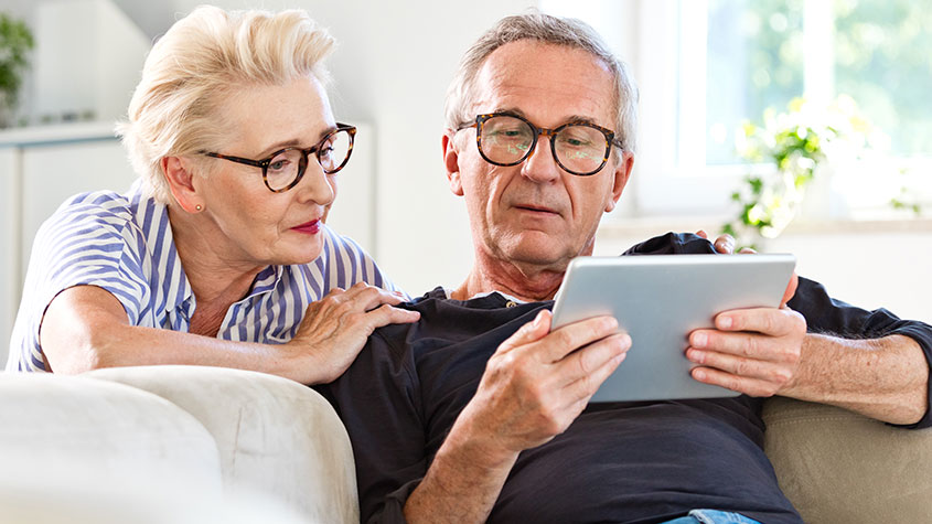 Old people looking at an iPad