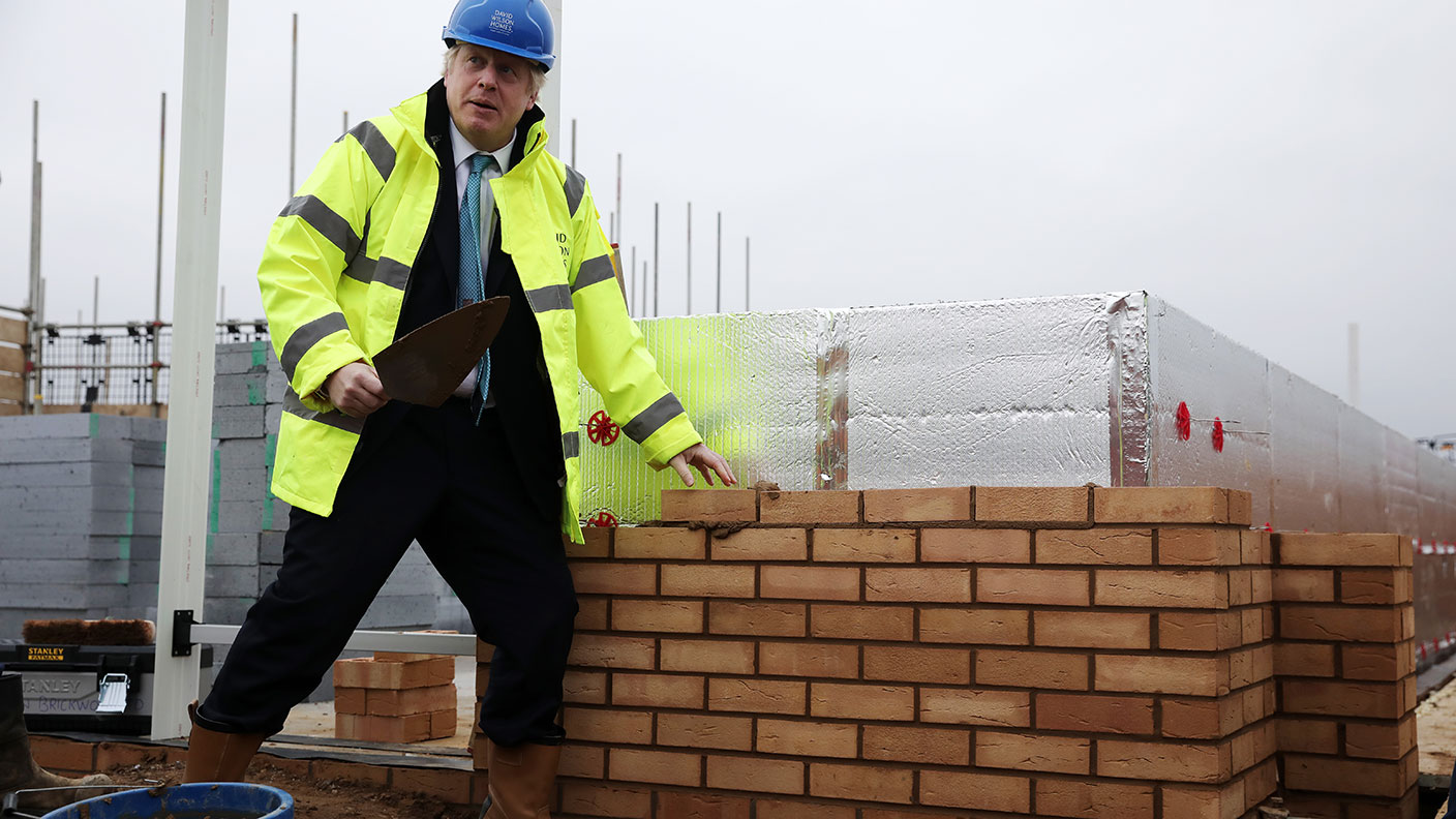 Boris Johnson pretending to lay bricks
