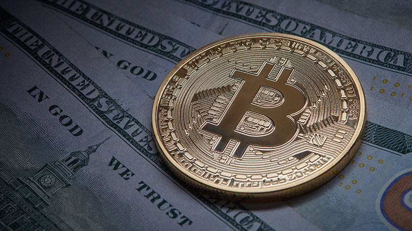 Bitcoin token on $100 bills