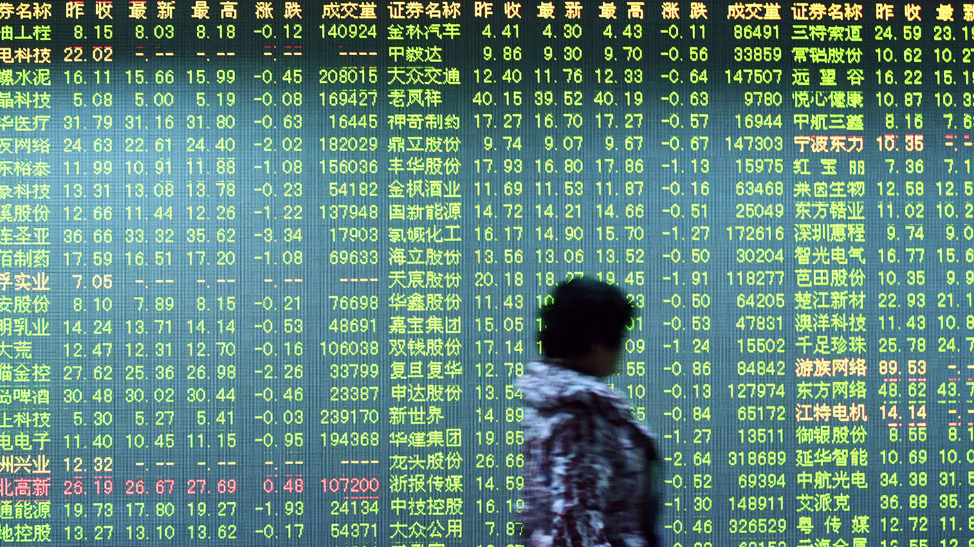 Chinese stocks on an indicator board © STR/AFP via Getty Images