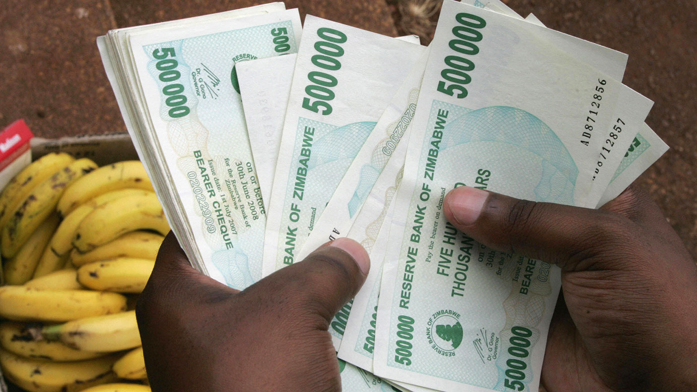 Handful of Zimbabwean $500,000 bills © ALEXANDER JOE/AFP via Getty Images