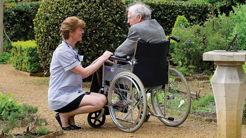 Nurse and a man in a wheelchair