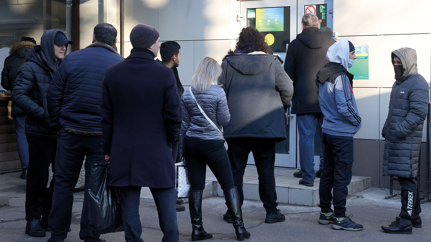 People queue at a Sberbank branch