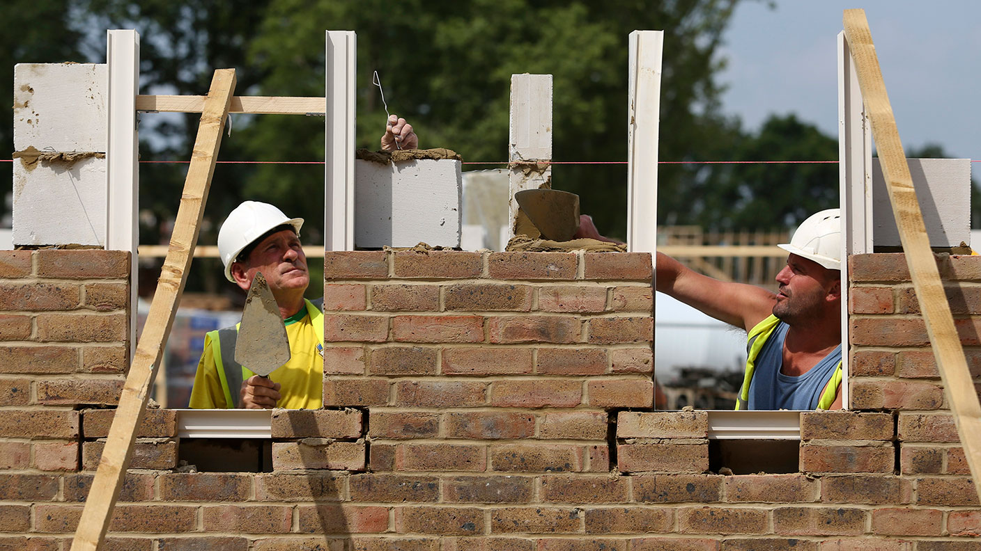Bricklayers building a house