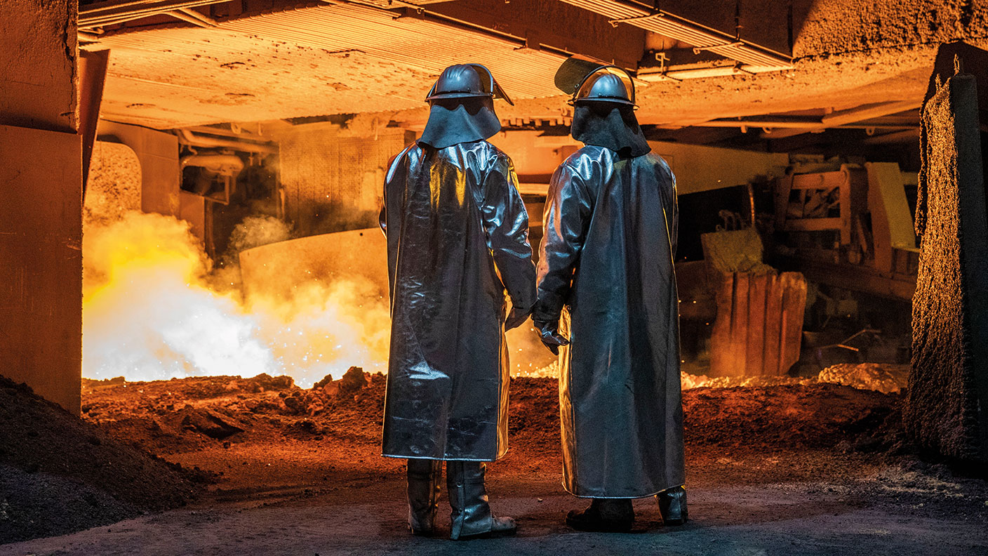 Steel workers at a blast furnace © Maja Hitij/Getty Images