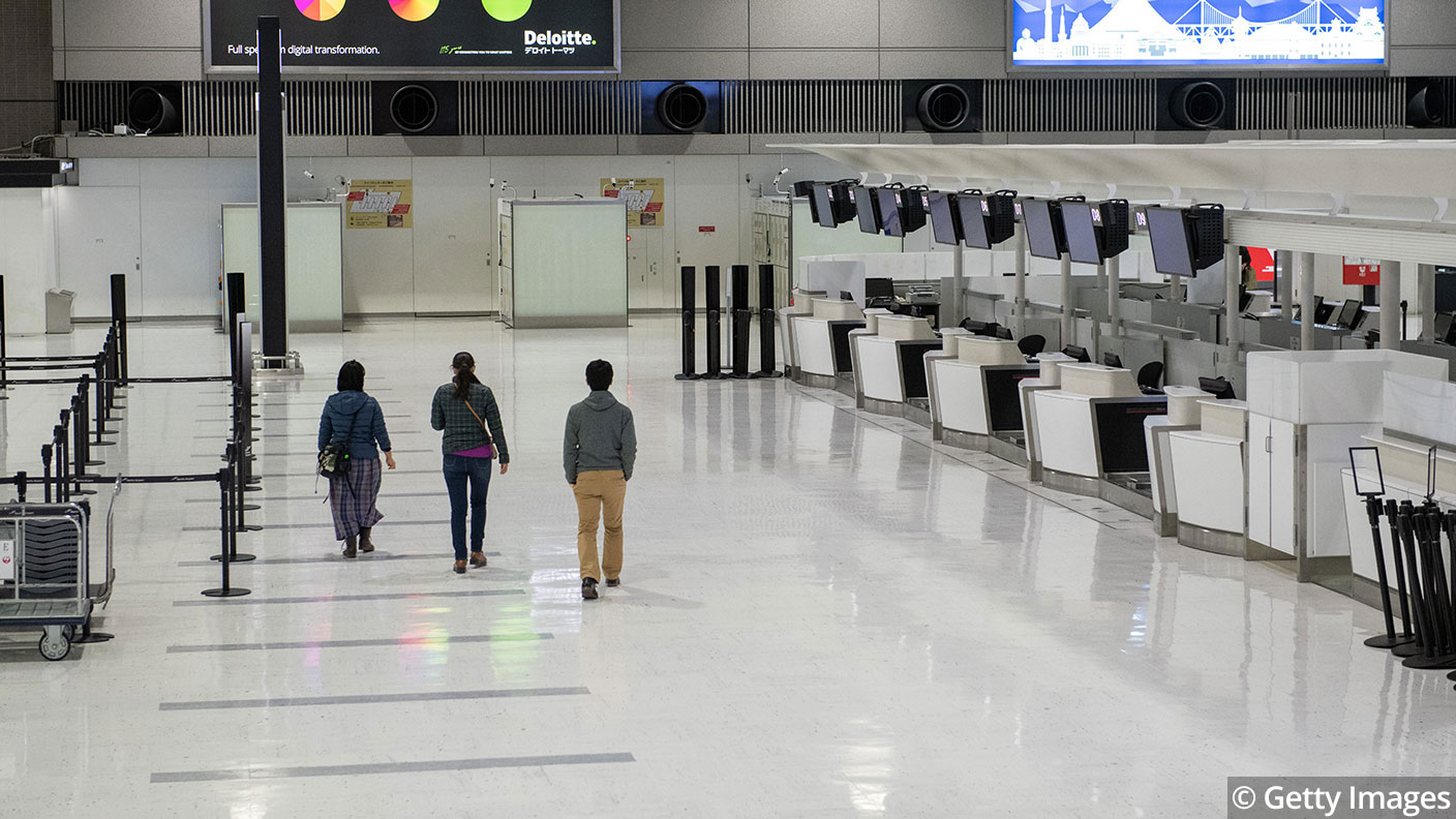 Empty check-in desks at Narita Airport © Carl Court/Getty Images