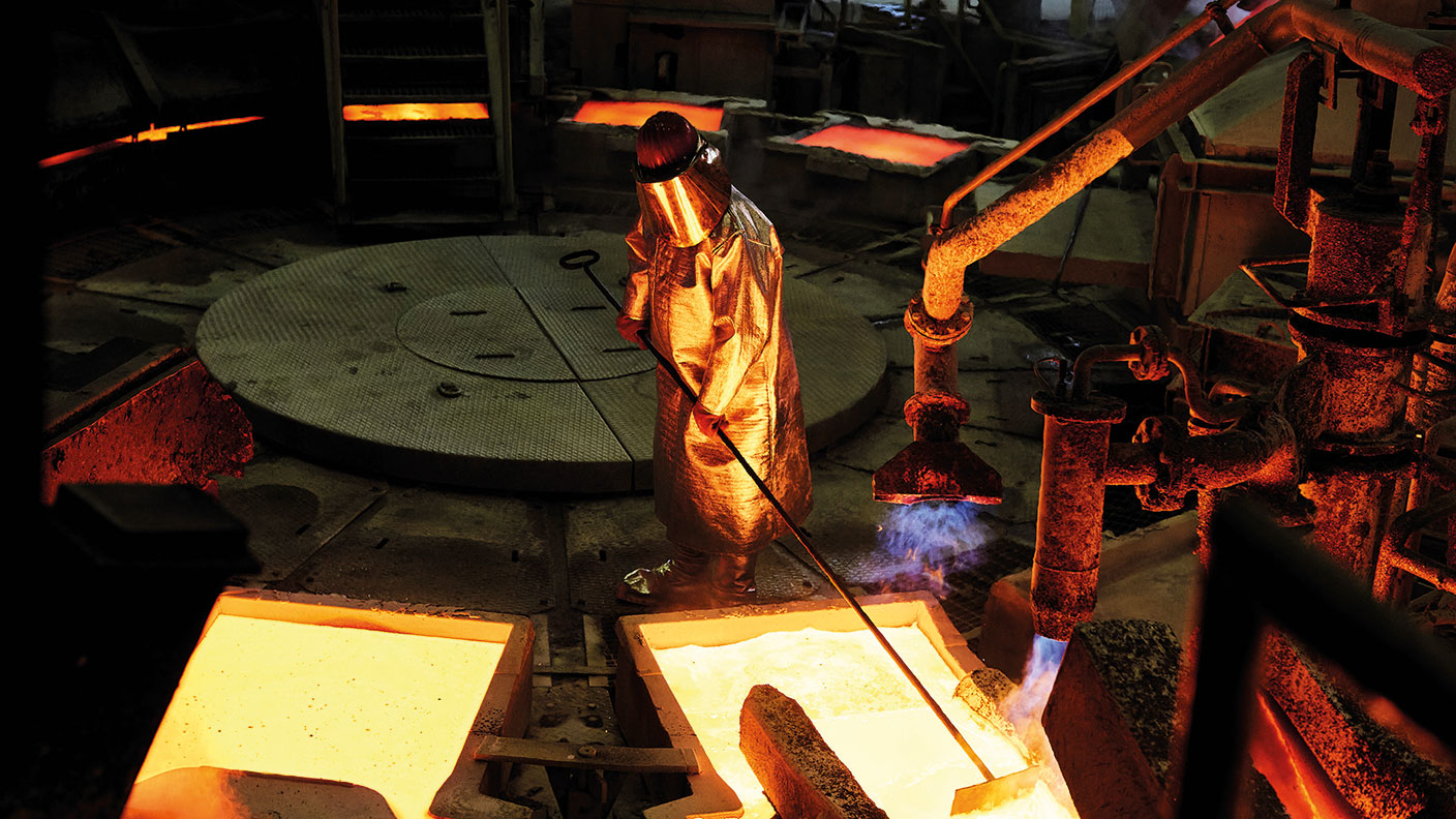 Worker smelting copper