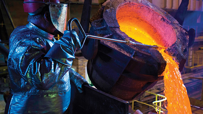 Molten silver being poured from a crucible © Molten silver from a ladle