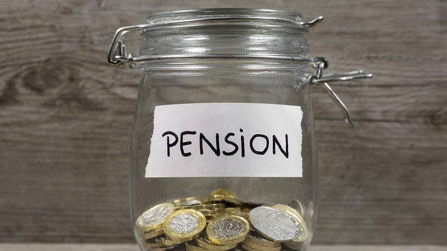 A jar of coins labelled pension