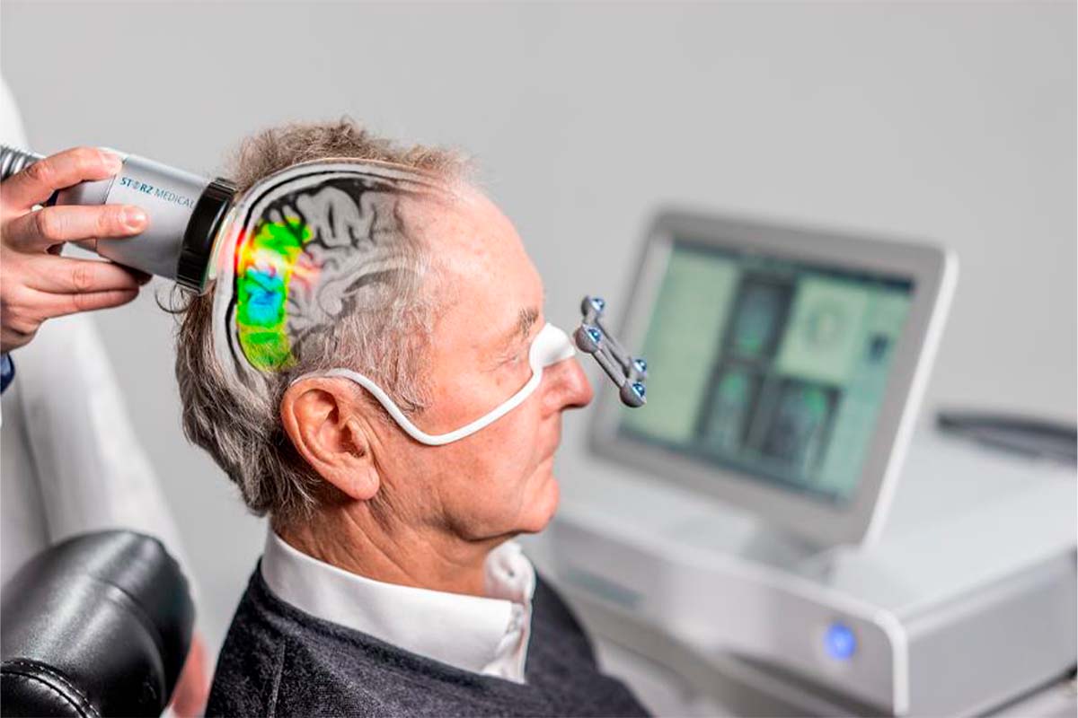 Patient receiving NeuroPulse Transcranial Pulse Stimulation treatment