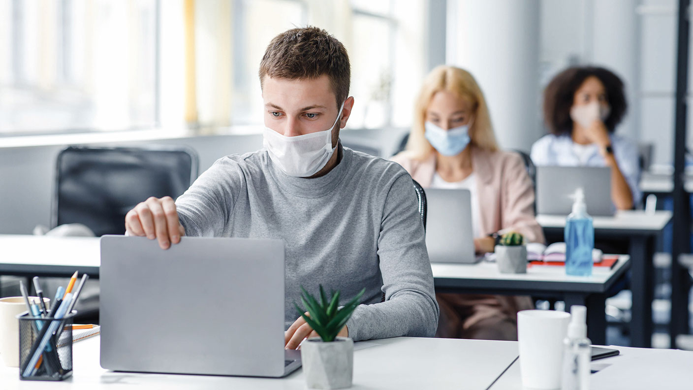 Masked people in an office