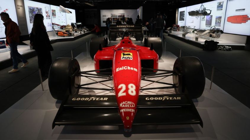 A formula 1 race car on display in an exhibition